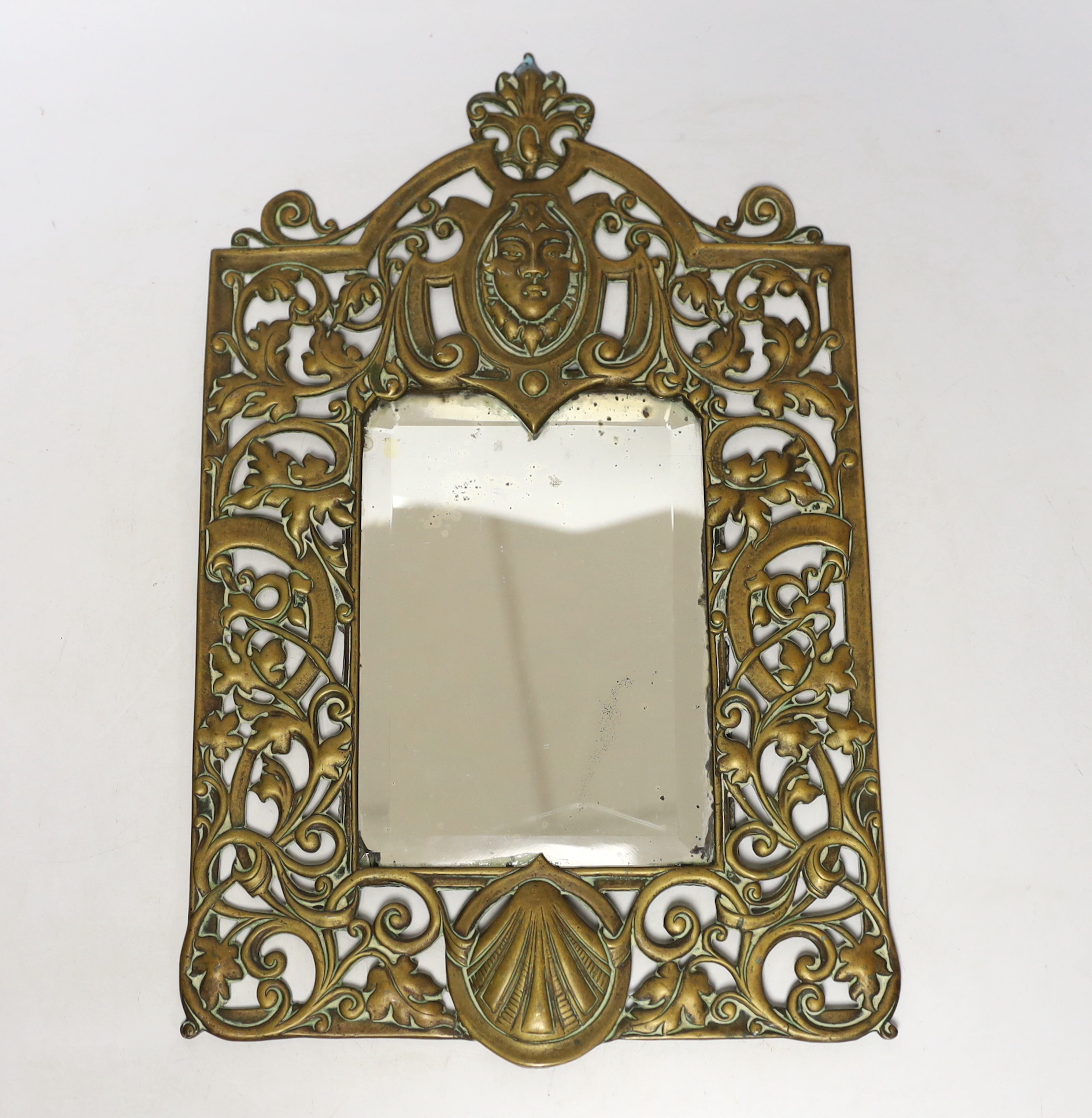 A brass framed mirror, 39cm high